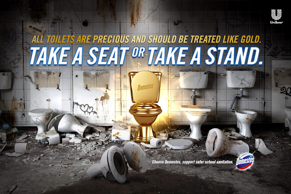An advertisement showing a dilapidated bathroom with broken and dirty toilets, except for one clean, gold-plated toilet, with the text "All toilets are precious and should be treated like gold. Take a seat or take a stand."