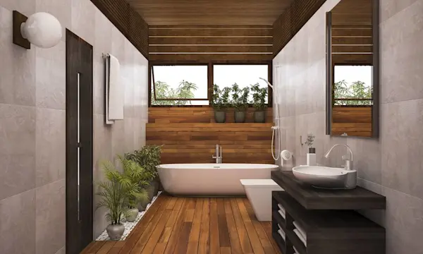 Kamar mandi modern dengan bathtub, wastafel, dan tanaman hias.