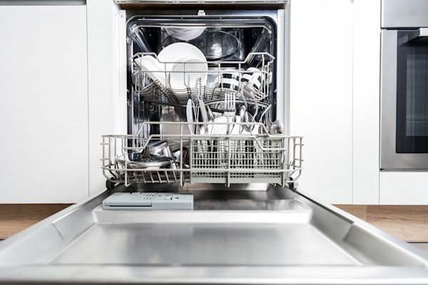 Open dishwasher with clean dishes.