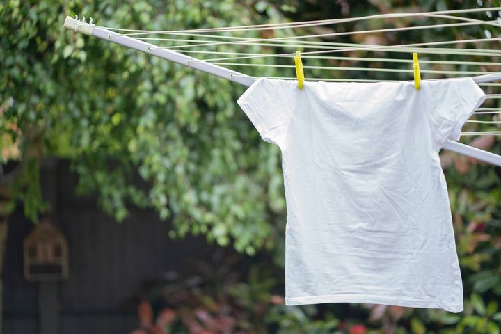 Line drying a white T-shirt outside