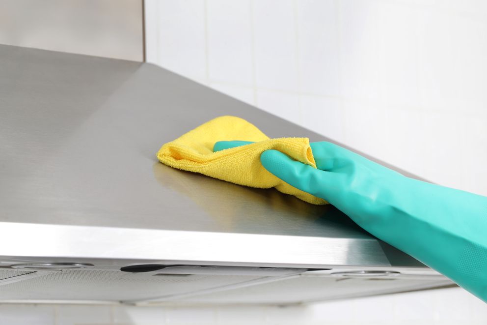 Step 3: clean cloth wiping on cooker hood