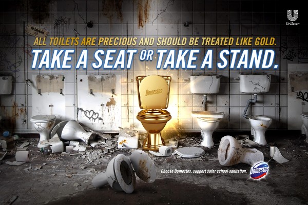 An advertisement showing a dilapidated bathroom with broken and dirty toilets, except for one clean, gold-plated toilet, with the text "All toilets are precious and should be treated like gold. Take a seat or take a stand."